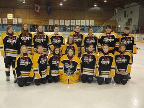 The Fairview Dunvegan Dynamite Bantam girls after taking first place in the Jasper tournament on Sunday, Dec. 8, 2012. The team members won their medals after beating the Grande Prairie Knights with a score of 6-0. (Photo courtesy of Jody Duvall)