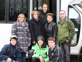 A new 21-seat bus was recently delivered to O’Gorman High School. A fundraising campaign is ongoing to pay for the vehicle, which will be used to take students to extracurricular activities. In front, from left, are OHS students Ryan Sasseville, RJ Roy and Scout Bielaskie; middle row O’Gorman Parents for Kids chairperson Monica Battiston, O’Gorman Foundation Chairperson Anne MacDonald, NCDSB trustee Colleen Landers, teacher Doug Basso; and in back, teacher Marcy McCarty.