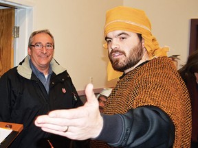 Calvary Baptist Church youth paster Kevin Schular greets people, including Wetaskiwin Salvation Army Major Terry Cook, at An Evening in Bethlehem, which was staged at the church from Dec. 7 to 9. More than 500 people took in the three day event. JEROLD LEBLANC PHOTO/WETASKIWIN TIMES/QMI AGENCY