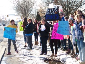 St. Lawrence Secondary School students stood in protest of Bill 115 during a student walkout on Tuesday, along with many other students across the province. Students are angry about the loss of their extracurricular activities.
Staff photo/ERIKA GLASBERG