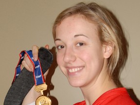 Rebecca Kohler with the gold medal Canada won at the IIHF Women's Under-18 Championship in January. (R. MARK BUTTERWICK  Times-Journal)