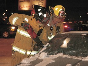 Firefighters use the Jaws of Life to help free a trapped occupant. QMI photo
