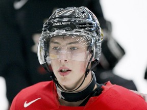 Ryan Nugent-Hopkins listens to a team chat during Team Red's opening skate during Canada's national junior team selection camp in Calgary. (Lyle Aspinall/QMI Agency)