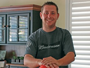 Jack Perry stands with his six perfect game rings in his home in Woodstock. Perry, the youngest person to bowl in the Professional Bowling Association at 15, recently won the 2012 Forty Frame Game National Bowling Championship becoming the first international winner in its 18-year history. The championship started with 10,405 bowlers.