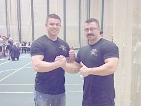 Submitted Photo
Peace River resident Mike Cartier (right) recently attended the UAPA PowerSurge III, a full powerlifting meet in Edmonton on December 1st and came away with a record. Pictured, Cartier stands with Peace River native Travis Rempel, who now lives in Red Deer.