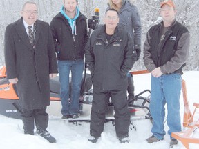 Logan Clow/R-G
The Peace Valley Snow Riders unveiled their new Arctic Cat trail groomer on Friday December 7, 2012 in Peace River. The club purchased the groomer from Peace River Ford with $10,000 funding from Shell- Peace River Divisionís Shell Community Investments Program and a matching grant from a Government of Alberta Community Initiatives Program. On hand for the unveiling were (l-r): MLA Frank Oberle, Travis Wood (Peace River Ford), Frank Armella (Snow Riders Secretary) Jenna Strachan (Shell) and Troy Lorencz (Club President).
