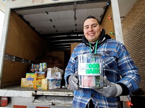 Dan Johnstone poses for a photo inside the panel truck which he camped in for 59-hours outside the Terra Losa Safeway last week.