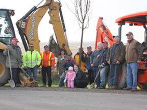 Four generations of residents, along with volunteers of Trees for Saugeen have been working together to invigorate the maple tree canopy along the historic 2nd Concession of Saugeen. PIctured during the last week of November 2012, from left to right are Kent Lamont, Bill Welsh, Daryl Faust, Victoria Serda, Gerry Lambert, Ken Pace, Robert Lamont, Terry Lamont, Ross Lamont, Bernard Schwass, Frazer Lamont, Rebecca Tait (Lamont) and daughter Aila Tait. Absent: Wilda Lamont, Lynda Baumberger and Tracy Lambert (photographer).