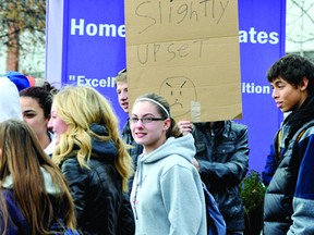 A wide range of signs in support of Thousand Islands Secondary School teachers found their way into the hands of students and onto the sidewalk in front of the high school during a student protest on Wednesday. (DARCY CHEEK The Recorder and Times)