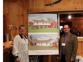 Heather Cross, president of the SLDMC Board of Directors, and architect Michael Paquette show off what the renovated and expanded St. Lawrence District Medical Centre is expected to look like when the expansion is complete.