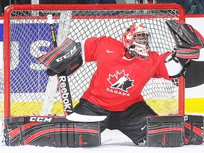 Team Canada goalie Malcolm Subban of the Belleville Bulls makes a glove save during a 4-1 exhibition loss to the University of Alberta Wednesday in Calgary. (Hockey Canada photo.)