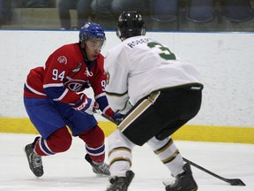 Kingston Voyageurs forward Ludlow Harris is all concentration as he tries to deke Cobourg Cougars’ Riley Robertson during Ontario Junior Hockey League action at the Invista Centre on Nov. 15. Harris has a team-leading 21 goals for the Voyageurs, who have been dealing with injuries and a lack of offence in recent weeks. (Whig-Standard file photo)