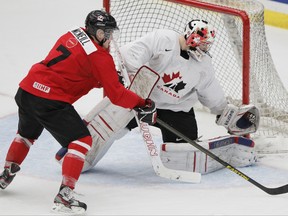 Team Canada hopeful Mark McNeill attempts a shots against Laurent Brossoit on Dec. 12, 2012 in Calgary. (Lyle Aspinall/QMI Agency)