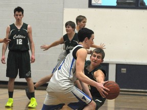 Celtic Justin Ruptash knocks the ball away from Titan Liam O’Hallahan.