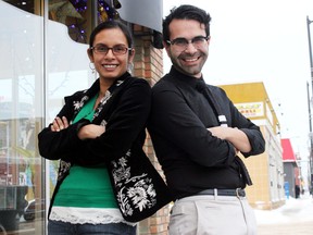 Natasha Deen and Omar Mouallem, the Edmonton Public Library’s new writers in residence, pose for a photo outside of the Carrot Cafe on 118 Avenue on Monday. DALE BOYD Special to the Examiner