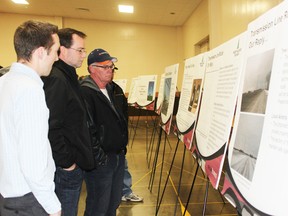 Terry Kramers and Pat Melady, who both live along the route for a transmission line proposed by Northland Power for a 40-turbine wind project near Grand Bend, ask questions of Chris Shilton at the company’s second public meeting last week in Seaforth.