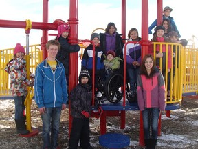 Kiana Green, Joel Kosa, and Kyler Dahl who are now in Grade 11 at Sexsmith Secondary school, as well as Brittany Gerber and Baylee Adams, who are students at Peace Wapiti Academy, were instrumental in getting a new playground for Robert W. Zahara school in Sexsmith.  After five years of fundraising, it opened this fall. (Supplied)