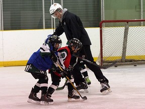 Edmonton Oil King defenceman and Oilers draft pick David Musil horses around with players on the Novice Warriors during a practice at the Broadmoor Arena on Tuesday. Photo by Shane Jones/Sherwood Park News/QMI Agency