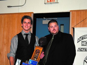 Team MVP Bryson Dobush and head coach Curtis Martin both appear to be thinking about the new grilled paninis at Tim Hortons during the recent Bev Facey Falcons annual football awards night. Photo supplied