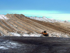 A bulldozer works on the growing mountain of snow from the 2012 fall, located west of the Strathcona County RCMP detachment. Photo Courtesy of Wilf Rice