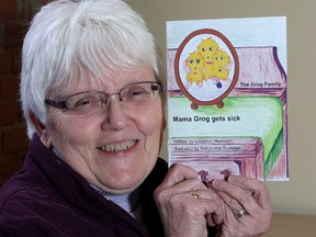 Gretchen Huntley shows off her book, Mama Grog Gets Sick. (Ian MacAlpine/The Whig-Standard)