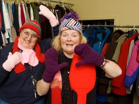 Phyllis Contois, left, and Donna Atkinson-Wilson have been knitting scarves, hats and mittens for homeless teenagers for 10 years. On Friday the women invite the public to participate in a Christmas sing-a-long in the downtown.