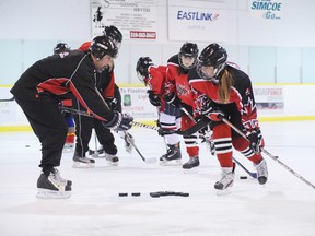 Jonathan Braemer, an expert instructor with the Hockey Skills Academy, has been hosting a series of clinics this season with members of the Norfolk HERicanes hockey club. The focus is on proper shooting technique. Here, Braemer schools Marissa McDonnell of Townsend on the right way to unload a wrist shot. (MONTE SONNENBERG Simcoe Reformer)