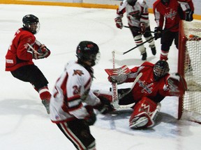 Caps goalie Bronson Ammeter makes a diving save during Wednesday's 7-5 loss to Pembina Valley.  (Handout)