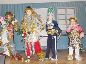 While Renfrew County’s public elementary schools were shut down by a one-day strike on Thursday, the Boys and Girls Club of Pembroke held a day camp at the Knights of Columbus Hall to keep the students occupied during this time. Here, from left, Gabriella McGillvray, Adam Klawitter, Christopher Renaud and Katrina Desjardins display cutting edge Christmas fashions, designed by themselves. For more community photos, please visit our website photo gallery at www.thedailyobserver.ca.