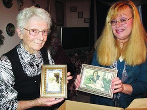 Sue Auty, who recently celebrated her 90th Birthday, looks at family photographs with her daughter Wendy Grass. Auty is the granddaughter of well-known carpenter-contractor Henry Hunter, who helped to construct a number of Kingston’s buildings.    Katrina Geenevasen - Kingston This Week