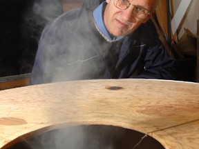 Sarnia's Louis Michaud, a retired Imperial Oil engineer,  has been awarded $300,000 by the San Francisco-based Thiel Foundation to take his atmospheric vortex engine to the next level. Michaud built a smaller model, pictured here in 2008, to demonstrate that a tornado can be simulated in a controlled fashion to produce power. Michaud's invention is the first outside the U.S. to receive a Thiel Foundation grant. THE OBSERVER FILE PHOTO/QMI AGENCY