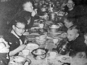 A pot luck supper was held at the First High River Boy Scout troop under Scoutmaster Hilton Anderson at the Scout Hall in this photo from December 1962.