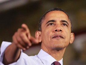 U.S. President Barack Obama gestures as he delivers remarks on the economy to employees at the Daimler Detroit Diesel plant in Redford, Michigan, December 10, 2012. (REUTERS/Jason Reed)