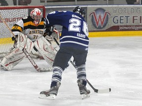 terry farrell/daily herald-tribune
Fort St. John’s Jeff Shipton is in alone on Darren Walker, but can’t beat the A’s goalie.