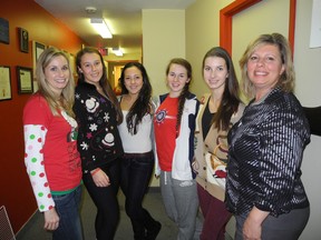 Marymount Academy teachers Kelly Leach and Lynn Masimiliano, with Toni Teale, Valentina Del Re, Jessica Whittaker and Erin McLelland, some of the students who helped organize the 23rd annual Christmas luncheon at the Sudbury Action Centre for Youth on Friday. (Laura Stricker/The Sudbury Star)
