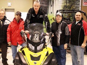 Mikey's General Sales donated a brand new snow machine to the Timmins Snowmobile Club on Friday, doing their part in ensuring the safest trails possible for the Timmins community. From left are Gilbert Fortin, Ivan Dery, Mike Mason, Hector St. Jean and Marc Drouin.