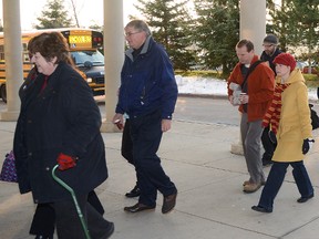 Teachers at OSCVI enter the school en mass shortly before classes begin Friday after an informal gathering outside in show of solidarity against Bill 115.