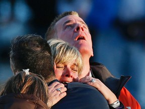 The families of victims grieve near Sandy Hook Elementary School, where a gunman opened fire on school children and staff in Newtown, Connecticut on December 14, 2012. A heavily armed gunman opened fire on school children and staff at a Connecticut elementary school on Friday, killing at least 26 people, including 20 children, in the latest in a series of shooting rampages that have tormented the United States this year.     REUTERS/Adrees Latif   (UNITED STATES - Tags: CRIME LAW EDUCATION TPX IMAGES OF THE DAY)
