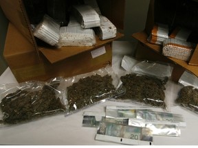 The RCMP announced the results of a one-year project aimed at dismantling the upper-tiers of a contraband tobacco and smuggling ring in the Cornwall area Sept. 27, 2012. Project Ostone resulted in 188 charges against 12 people. Cops seized marijuana, cash and 401 cases of cigarettes. DOUG HEMPSTEAD/Ottawa Sun