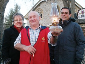 The congregation of St. Andrew’s United Church in Williamstown is wrapping up its 225th anniversary with a kerosene lit Christmas Eve service. From left are St. Andrew’s minister, Rev. Andrea Harrison, lamplighter Stanley Swerdfeger, and board of governors chair Mike Seguin.
Staff photo/GREG PEERENBOOM