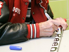 Expositor file photo

One of the attractions of the annual Wayne Gretzky International Minor Hockey Tournament is Wayne's dad, Walter, shown here autographing a stick during last year's event.