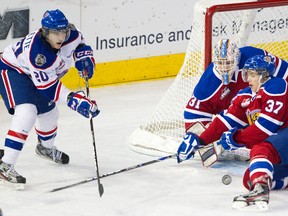 Edmonton's Dustin Mayo and goalie Laurent Broissoit keep Regina's Trent Ouellette at bay Sunday afternoon at Rexall Place (Amber Bracken, Edmonton Sun).