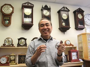 Chong Cao in his DocTime watch and clock repair shop on Montreal Street. (Michael Lea The Whig-Standard)