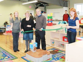 Pictured (left to right) Board member Linnea Catalan, President Tanya Stepaniak, supervisor and teacher Dorothy Chubb, Mayor Mike Smith, board member Katherine Martinko as they cut the ribbon to celebrate the Kids Street Cooperative Nursery School newly renovated and enlarged space on Dec. 9.