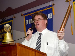 John Lewis holds a piece of the brass dance pole from the Sherwood Forest Inn on Friday during the annual Kiwanis lunch. The piece was auctioned off during the event, which raised $85,000 which goes towards the Salvation Army. 
EMILY MOUNTNEY/TRENTONIAN/QMI AGENCY