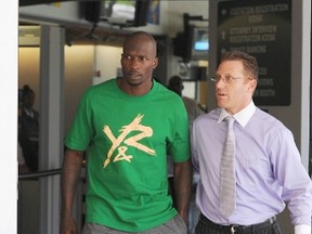 Chad Johnson (left) leaves Broward County Jail after being arrested on suspicion of domestic violence in Fort Lauderdale, Fla., on Aug. 12, 2012. (WENN.com/Files)