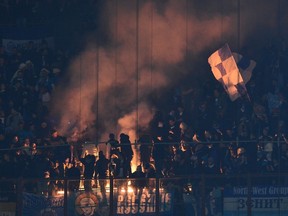 FC Zenit's supporters cheer their team during a Champions League match against AC Milan at the San Siro Stadium in Milan earlier this month. (AFP)