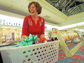 Jennifer Freiburger, a Steelton Senior Citizen’s Centre volunteer, carries out wrapping duties at Station Mall.