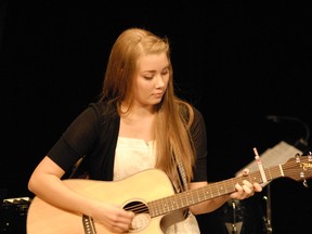 Stephanie Rudnew plays guitar