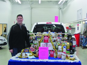 Portage Toyota & RV general manager Doug Thompson pictured with the items already collected during the dealerships food drive which kicked off on Dec. 10. Portage Toyota will continue to collect donations until Jan. 2 when they will be donated to the local food bank. (ROBIN DUDGEON/THE DAILY GRAPHIC/QMI AGENCY)